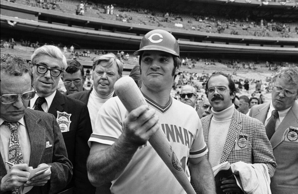 FILE - In this Oct. 9, 1973, file photo, Cincinnati Reds' Pete Rose holds a bat as he talks to the press prior to workout at Shea Stadium in New York. Baseball Commissioner Rob Manfred has rejected Pete Roseís plea for reinstatement, citing his continued gambling and evidence that he bet on games when he was playing for the Cincinnati Reds. Manfred says in a letter sent to Rose and made public on Monday, Dec. 14, 2015, that baseballís hits king hasnít been completely honest about his gambling on baseball games. (AP Photo/File)