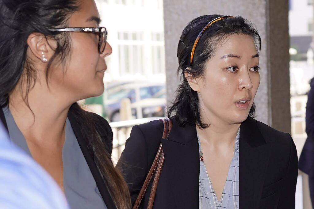 Tiffany Li, right, arrives at the courthouse Thursday, Sept. 12, 2019, in Redwood City, Calif. The trial of Li, a Chinese real estate scion who posted a $35 million bail after being charged with orchestrating the 2016 murder of her children's father, is set to start Thursday.(AP Photo/Tony Avelar)