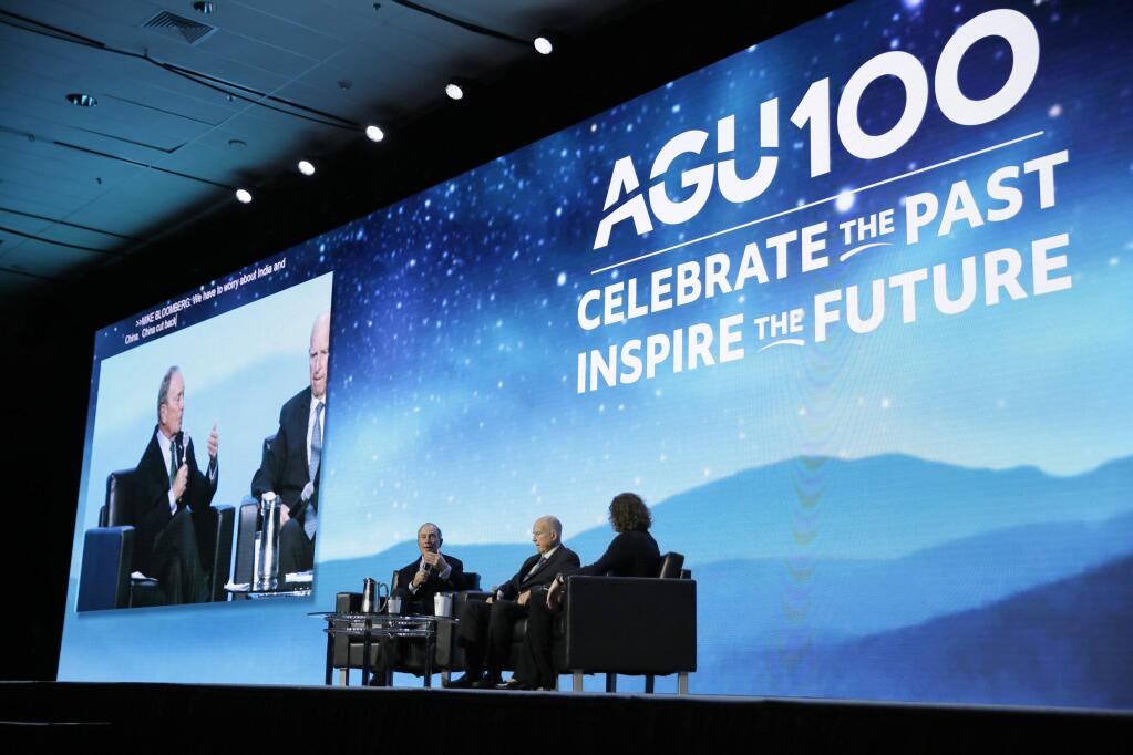 Democratic presidential candidate and former New York City Mayor Michael Bloomberg, left, takes part in an on-stage conversation with former California Gov. Jerry Brown, center, at the American Geophysical Union fall meeting Wednesday, Dec. 11, 2019, in San Francisco. Bloomberg made his first visit to California as a Democratic presidential candidate, appearing earlier with the mayor of Stockton who's championed universal basic income. Bloomberg and Brown talked about America's Pledge, bringing together leaders to ensure the U.S. remains a global leader in reducing emissions and delivering the goals of the Paris Agreement. (AP Photo/Eric Risberg)