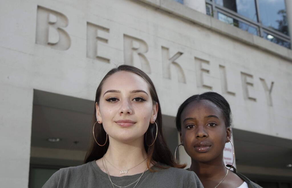 Berkeley High School president-elect Lexie Tesch, left, and vice president-elect Daijah Conerly pose for photos in Berkeley, Calif., Thursday, April 11, 2019. The first online election for student government at Berkeley High School became a lesson in more than democracy. Students also learned about vote fraud, hacking and digital privacy after a high school junior who was running for class president cast hundreds of fake online votes for himself. (AP Photo/Jeff Chiu)
