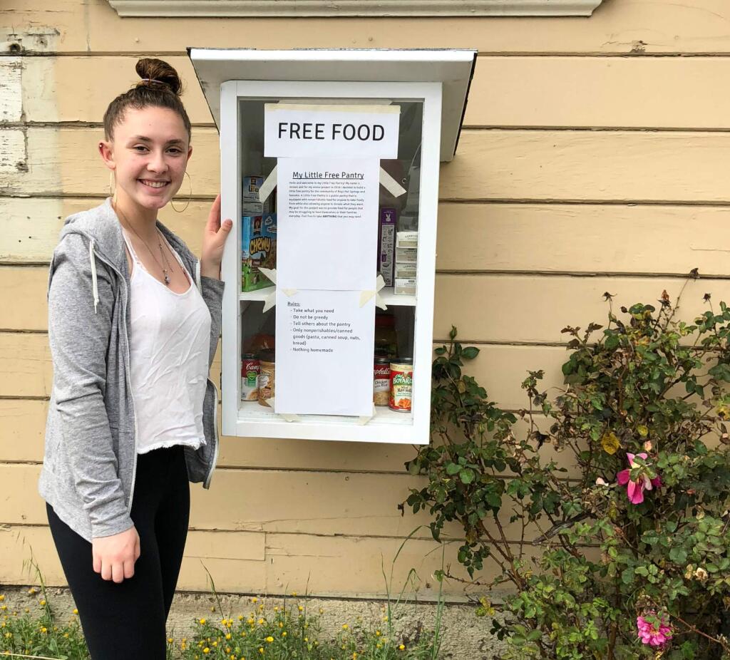 SVHS senior Jensen Hedley in front of her Little Free Pantry in the Springs.