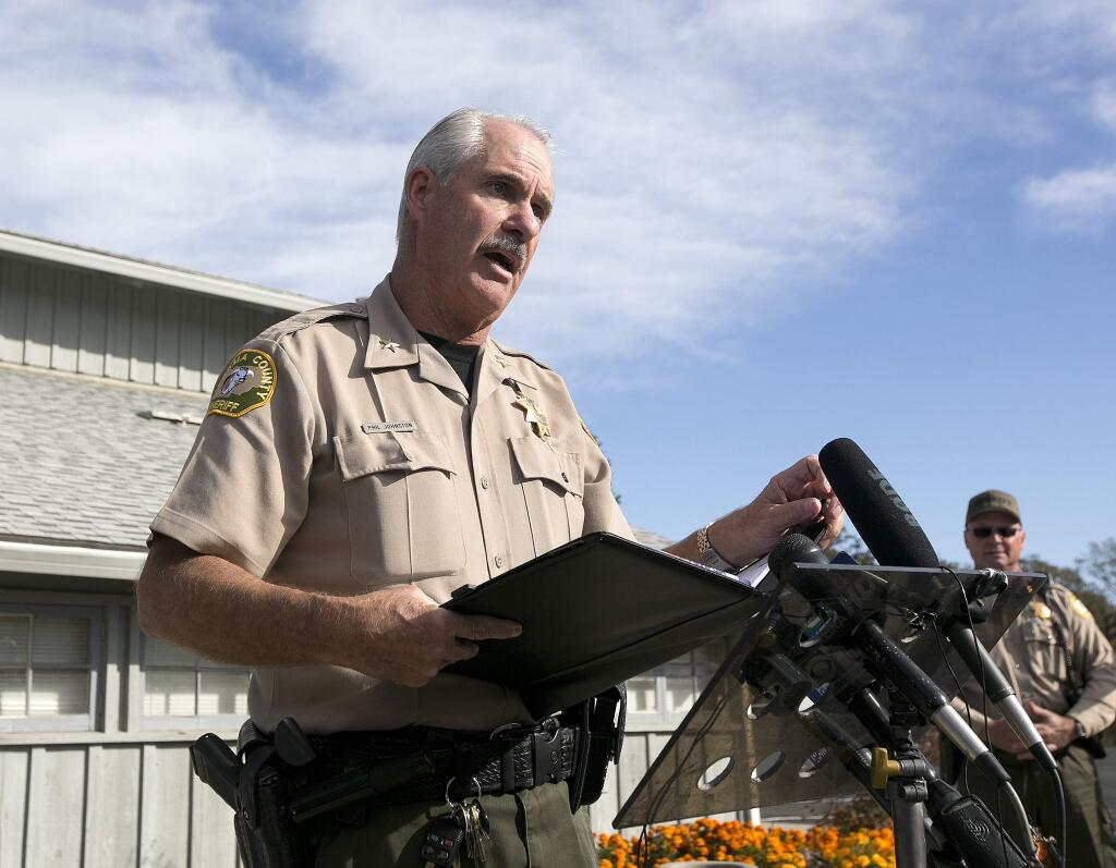 Phil Johnston, the assistant sheriff for Tehama County, briefs reporters on the shootings near the Rancho Tehama Elementary School, Tuesday, Nov. 14, 2017, in Corning, Calif. Authorities said, a gunman choosing targets at random, opened fire in a rural Northern California town Tuesday, killing four people at several sites and wounding others at the elementary school before police shot him dead. (AP Photo/Rich Pedroncelli)