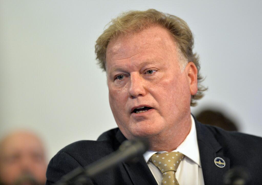 FILE - In this Tuesday, Dec. 12, 2017, file photo, Kentucky State Rep. Republican Dan Johnson addresses the public from his church regarding sexual assault allegations in Louisville, Ky. Johnson died Wednesday night, Dec. 13, 2017. Bullitt County Coroner Dave Billings says it was 'probably suicide,' and an autopsy is scheduled for Thursday morning. (AP Photo/Timothy D. Easley, File)