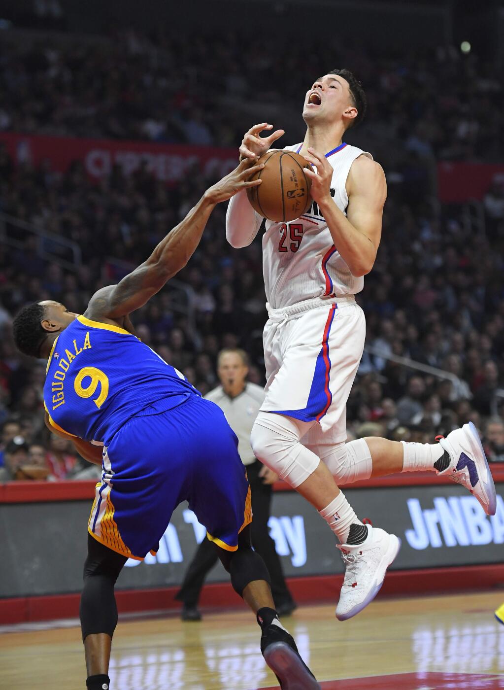 Golden State Warriors forward Andre Iguodala, left, blocks the shot of Los Angeles Clippers guard Austin Rivers during the first half of an NBA basketball game, Wednesday, Dec. 7, 2016, in Los Angeles. (AP Photo/Mark J. Terrill)