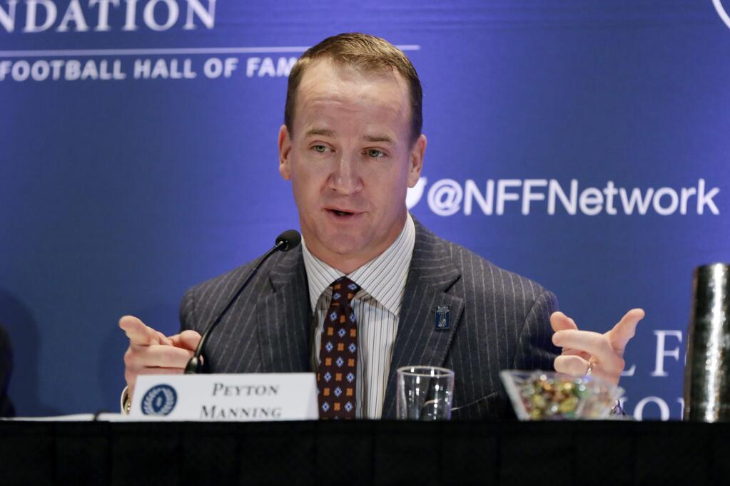 Former University of Tennessee quarterback Peyton Manning answers questions during a news conference of the National Football Foundation College and Football Hall of Fame, in New York, Tuesday, Dec. 5, 2017. (AP Photo/Richard Drew)