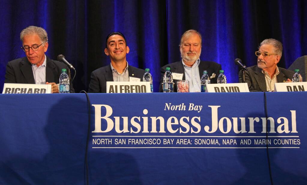 Napa-based wine attorney Richard Mendelson, left, moderates a panel discussion on challenges for Napa Valley growth, during North Bay Business Journal's Impact Napa conference held at The Meritage Resort & Spa on Aug. 5, 2016. Panelists are, from left, Alfredo Pedroza, Napa County supervisor; David Graves, Saintsbury winery; Dan Mufso, Napa Vision 2050. (JEFF QUACKENBUSH / NORTH BAY BUSINESS JOURNAL)