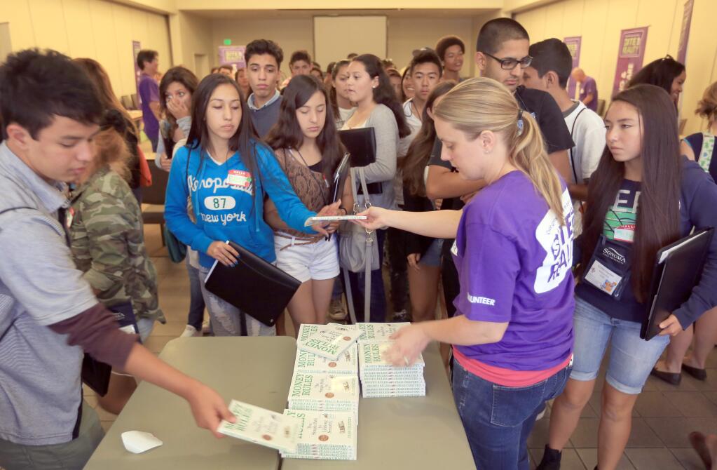 Literature is handed out during a seminar for disadvantaged kids, Friday Aug. 1, 2014 at Sonoma State University in Rohnert Park. (Kent Porter / Press Democrat)
