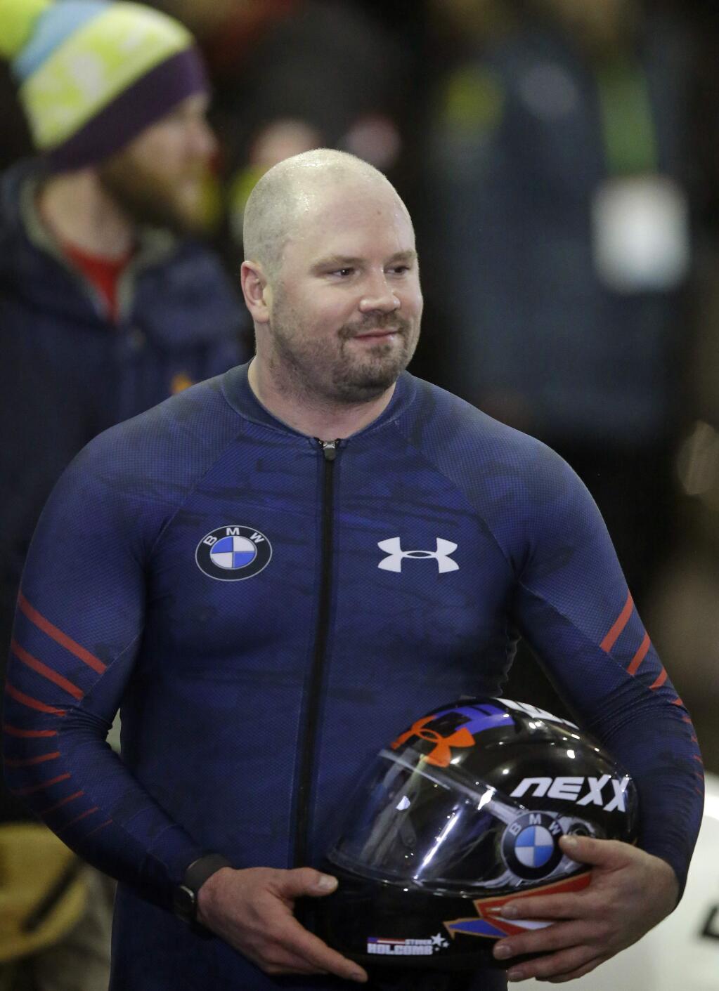 United States driver Steven Holcomb looks on after competing in a four-man bobsled World Cup race Saturday, Jan. 16, 2016, in Park City, Utah. (AP Photo/Rick Bowmer)