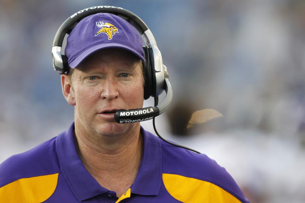 FILE - In this Aug. 13, 2011, file photo, Minnesota Vikings offensive coordinator Bill Musgrave walks the sideline during the first quarter of an NFL football preseason game against the Tennessee Titans in Nashville, Tenn. (AP Photo/Wade Payne, File)