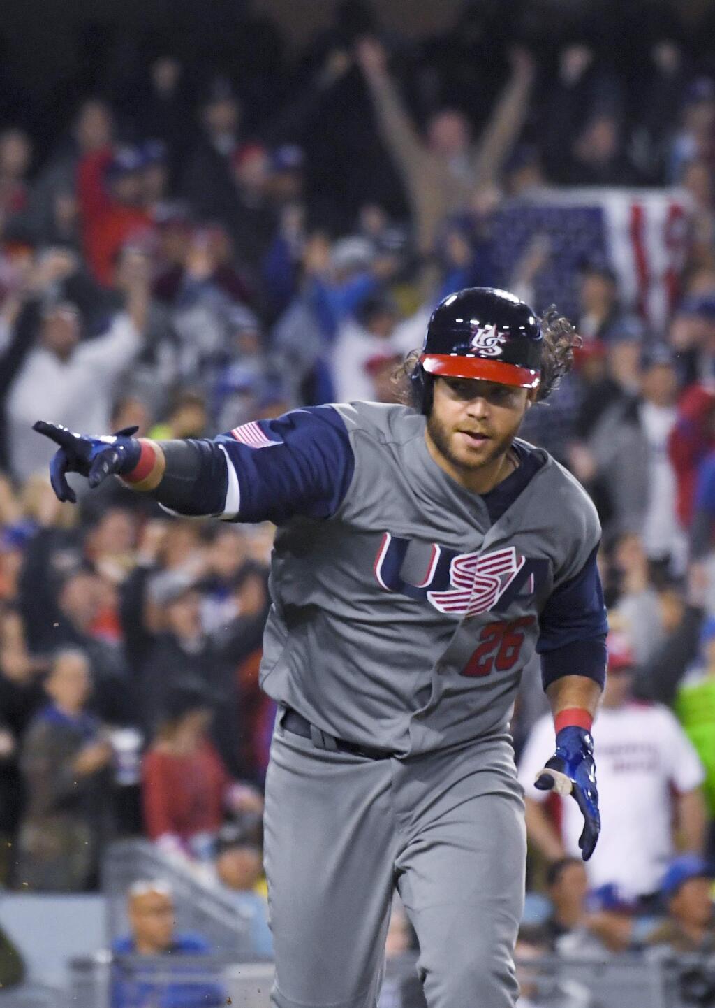 United States' Brandon Crawford celebrates a two-run single against Puerto Rico during the seventh inning of the final of the World Baseball Classic in Los Angeles, Wednesday, March 22, 2017. (AP Photo/Mark J. Terrill)