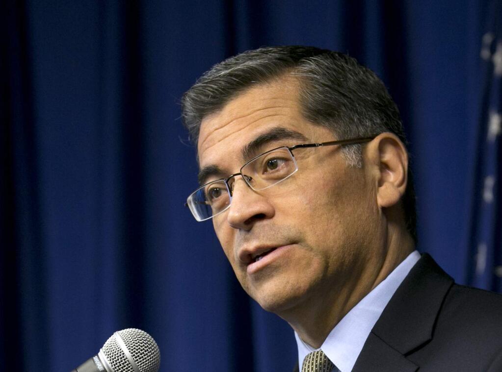 FILE -- In this Jan. 24, 2018, file photo, California Attorney General Xavier Becerra speaks at a news conference in Sacramento, Calif. A report released by the state auditor, Thursday, May 31, 2018, says California is underreporting hate crimes to the FBI and largely blame's Becerra's state Department of Justice for not requiring local agencies to do a better job. Becerra immediately announced a new hate crimes prevention website and brochure, as well as more guidance for local law enforcement agencies. (AP Photo/Rich Pedroncelli, File)