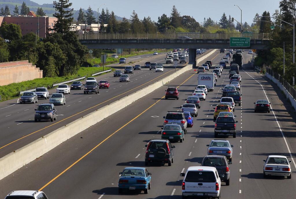 Vehicles travel along Highway 101, south of the Mendocino overcrossing in Santa Rosa. (Christopher Chung/ PD FILE)