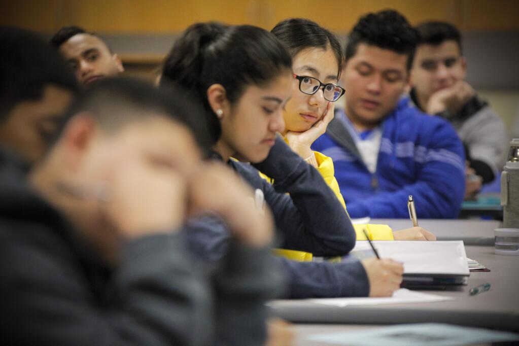 Petaluma, CA. Wednesday, January 11, 2017._Qian Qian Xia listens as Casa Grande HS teacher, Tom Griffin teaches an ESL (English as Second Language) class. His students have expressed concern over the immigration policies of the president-elect who will be inaugurated on January 20th. (CRISSY PASCUAL/ARGUS-COURIER STAFF)