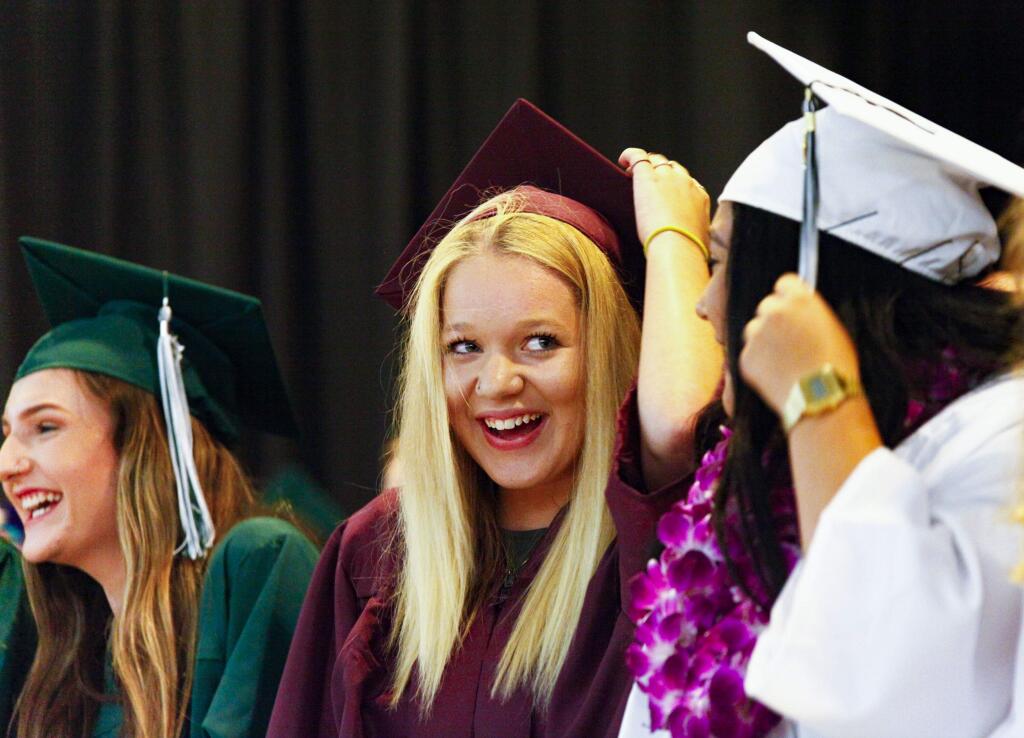 Petaluma, CA. Wednesday, May 31, 2017._ Haley Smiley of Valley Oaks High School proudly moves her tassel from the right to the left, signifying that she has earned her high school degree. (CRISSY PASCUAL/ARGUS-COURIER STAFF)