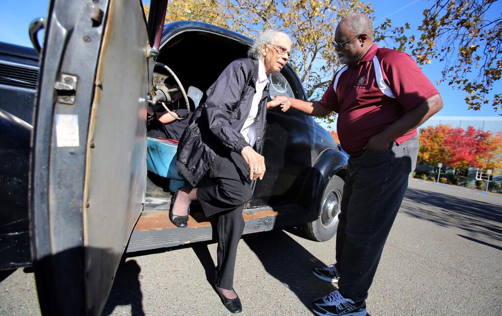 Ron Blasingame helps his 91-year-old mother, Clara Mae Blasingame, out of the 1937 Ford Coupe that she learned to drive in when she was 13, in Santa Rosa on Wednesday, November 26, 2014. (Christopher Chung/ The Press Democrat)