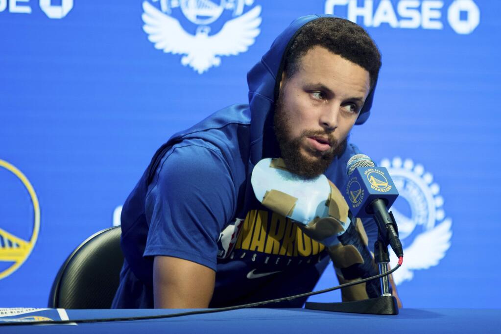 Golden State Warriors' Stephen Curry speaks at a news conference before an NBA basketball game against the Utah Jazz in San Francisco, Monday, Nov. 11, 2019. (AP Photo/John Hefti)