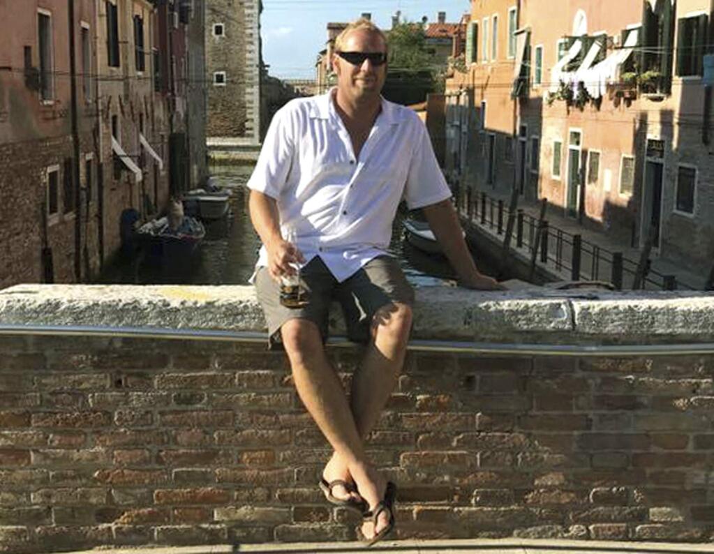 This August 2017 photo provided by Heidi Nunes-Tucker shows her husband, Jared Tucker, during a trip to Venice, Italy. Jared Tucker, a California resident along with his wife were ending their European vacation in Barcelona and were on their way to a beach when they decided to stop at a cafe on Las Ramblas. Jared Tucker was one of the victims of the Thursday, Aug. 17, attacks in Barcelona. (Heidi Nunes Tucker via AP)