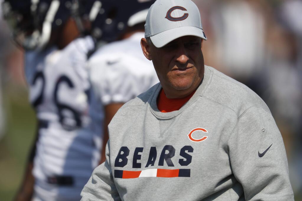 Chicago Bears defensive coordinator Vic Fangio takes part in drills during a joint training camp session Wednesday, Aug. 15, 2018, at Broncos' headquarters in Englewood, Colo. (AP Photo/David Zalubowski)