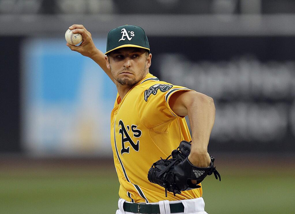 Oakland Athletics pitcher Kendall Graveman works against the Cleveland Indians in the first inning of a baseball game Friday, July 31, 2015, in Oakland. (AP Photo/Ben Margot)