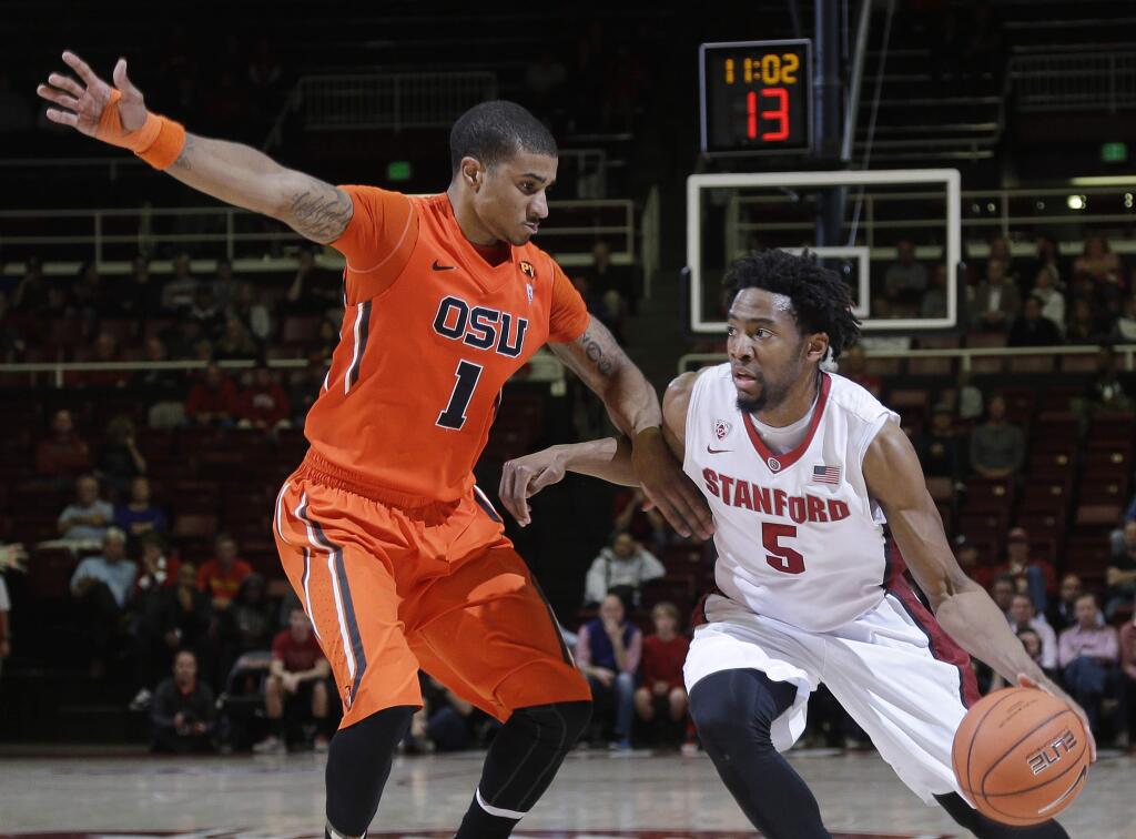 Stanford guard Chasson Randle, right, dribbles next to Oregon State guard Gary Payton II during the second half of a game Thursday, Feb. 26, 2015, in Stanford. Stanford won 75-48. (AP Photo/Marcio Jose Sanchez)