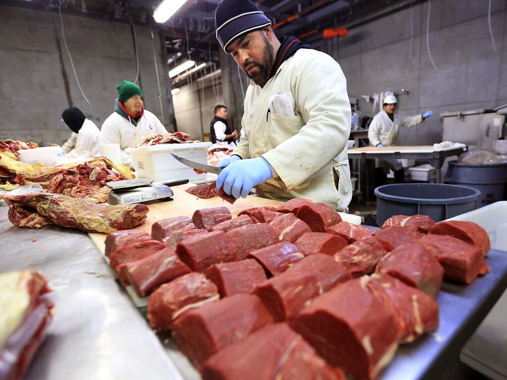 Head butcher Rafael Lopez cuts filets at the Marin Sun Farms meat processing plant in Petaluma. (JOHN BURGESS/ PD FILE, 2015)