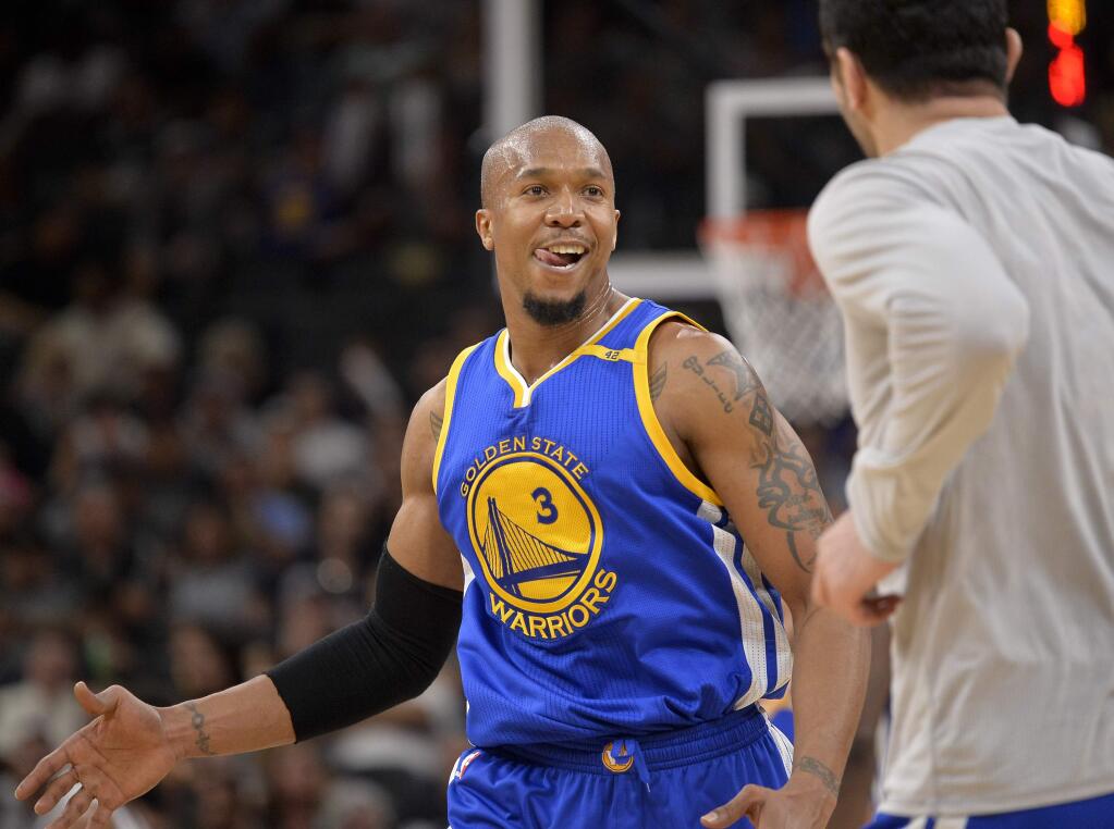 In this March 29, 2017, file photo, the Golden State Warriors' David West reacts to the win after the team's game against the San Antonio Spurs in San Antonio. (AP Photo/Darren Abate, File)