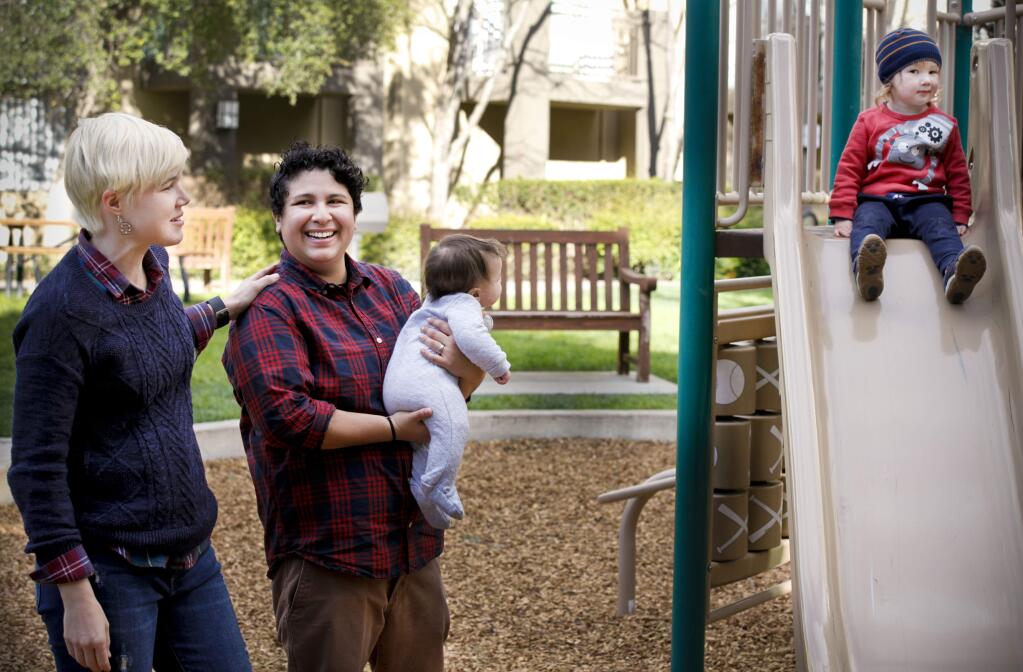Zahyra Garcia,29, (center, holding baby) is a local activist and a founding member of North Bay LGBTQI Families. She and her wife, Chelsea,29, met in San Francisco and moved to Petaluma where they are raising their two children, Pyas, 2, and Tybee, 4 months. (CRISSY PASCUAL/ARGUS-COURIER STAFF)