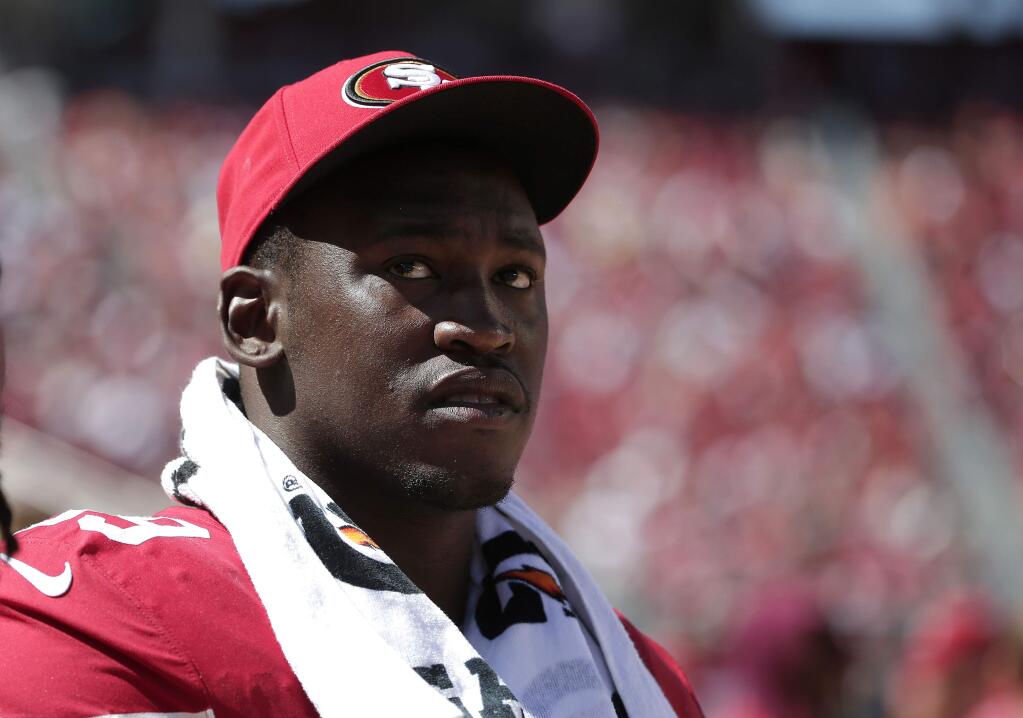 In this Aug. 17, 2014, file photo, San Francisco 49ers linebacker Aldon Smith watches from the sideline during the second half of a game against the Denver Broncos in Santa Clara. (AP Photo/Marcio Jose Sanchez, File)