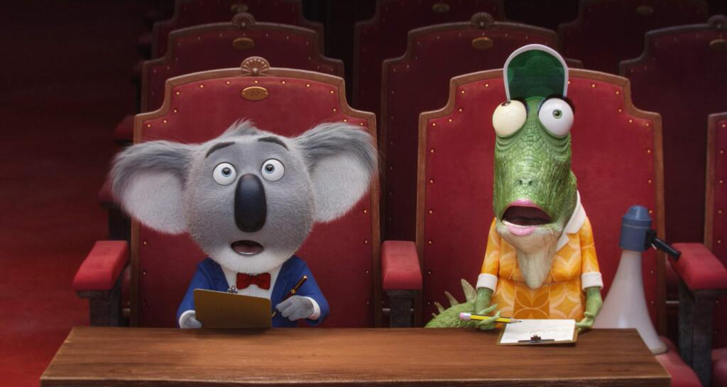 In 'Sing,' amateur hopefuls are competing for a once-in-a-lifetime record deal, but theater owner/koala Buster Moon (Matthew McConaughey, with Garth Jennings as his green iguana assistant) thinks only about saving his beloved venue. (ILLUMINATION ENTERTAINMENT)