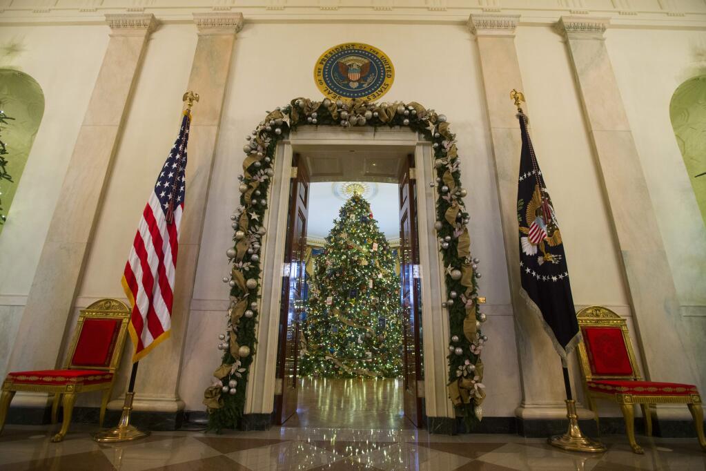 A view of the White House Christmas tree in the Blue Room of the White House in Washington, Wednesday, Dec. 3, 2014, during a tour of the White House holiday decoration. This years theme for the White House decorations is a childrens winter wonderland. About 65,000 people are expected to visit the White House during the holidays. (AP Photo/Evan Vucci)