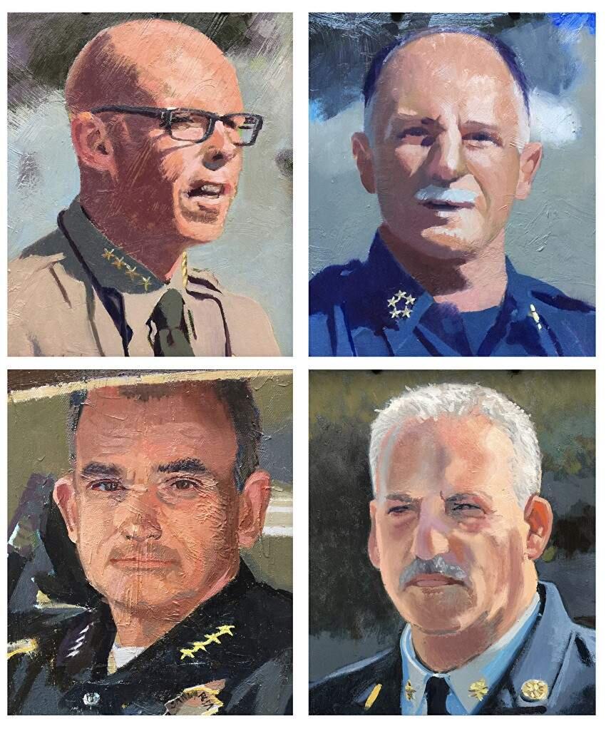 Artist John Deckert created portraits and presented them to, from upper left,Sheriff Rob Giordano, Cal Fire Director Ken Pimlott, Santa Rosa Fire Chief Tony Gossner and Santa Rosa Police Chief Hank Schreeder.