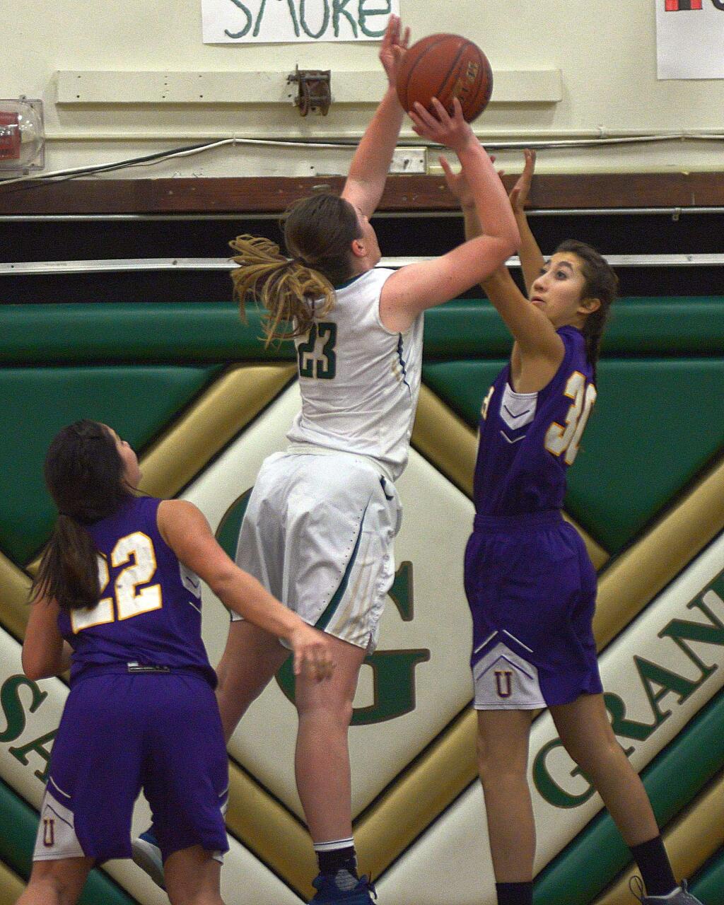 SUMNER FOWLER/FOR THE ARGUS-COURIERCasa Grande's Mia Cain shoots over Ukiah defender Valentina Evans in a NorthBay League game won by Ukiah.