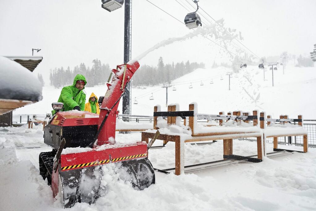 In this photo provided by the Mammoth Mountain Ski Area, snow is cleared away at the Mammoth Mountain resort Thursday, Nov. 16, 2017, in Mammoth Lakes, Calif. An early winter Sierra storm that dumped more than 2 feet of snow in the mountains and heavy rain in the valleys triggered power outages and school delays at Lake Tahoe and snarled traffic during the Thursday morning commute in Reno. (Peter Morning/Mammoth Mountain Ski Area via AP)