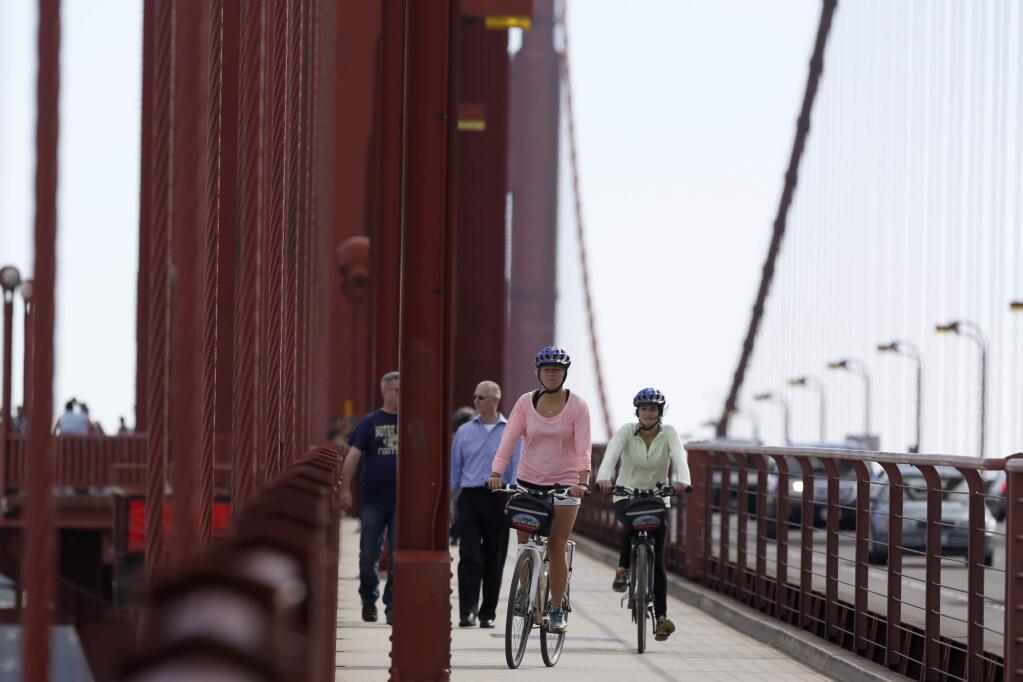 Cyclists and pedestrians cross the Golden Gate Bridge in 2014. (BETH SCHLANKER/ PD FILE)