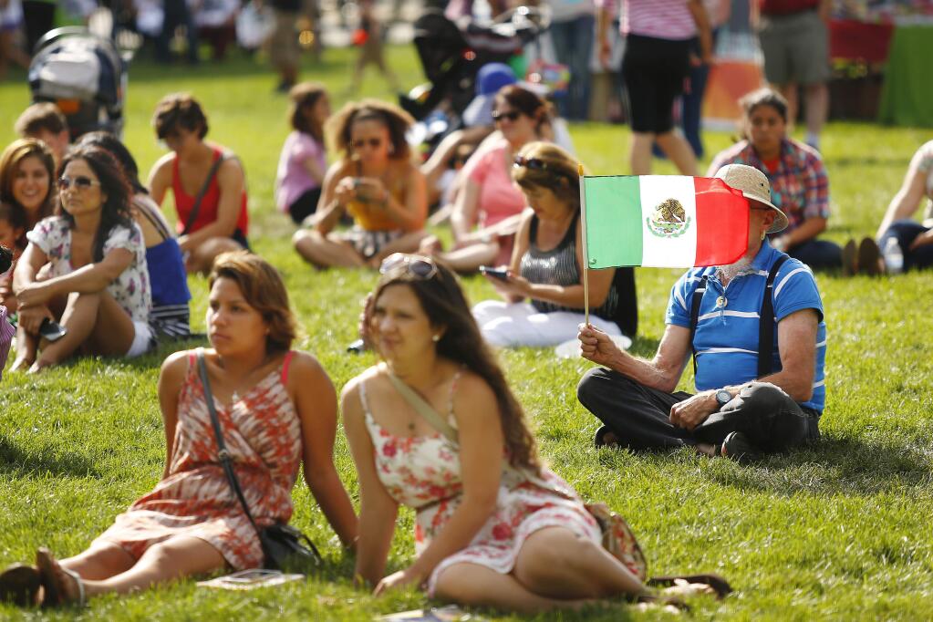 A crowd listens to traditional mariachi music at the 5th Annual Fiesta de Independencia at the Wells Fargo Center in Santa Rosa on Saturday, September 13, 2014. (Conner Jay/The Press Democrat)