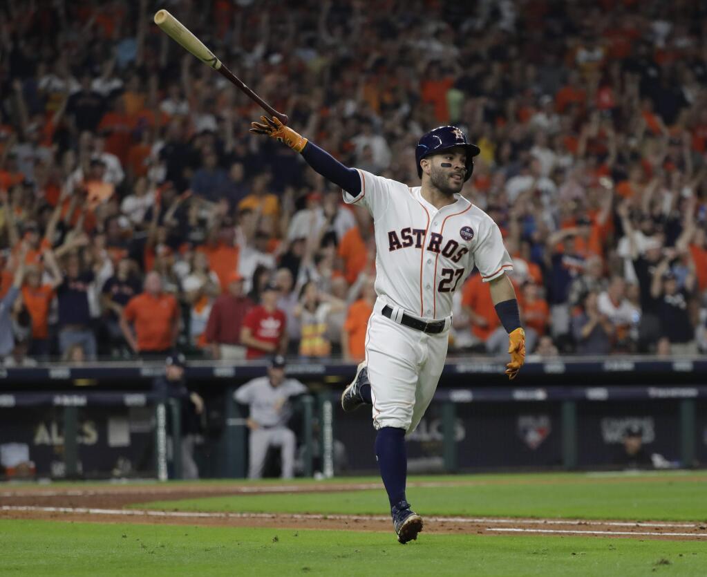 The Houston Astros' Jose Altuve celebrates after hitting a home run during the fifth inning of Game 7 of the American League Championship Series against the New York Yankees Saturday, Oct. 21, 2017, in Houston. (AP Photo/David J. Phillip)