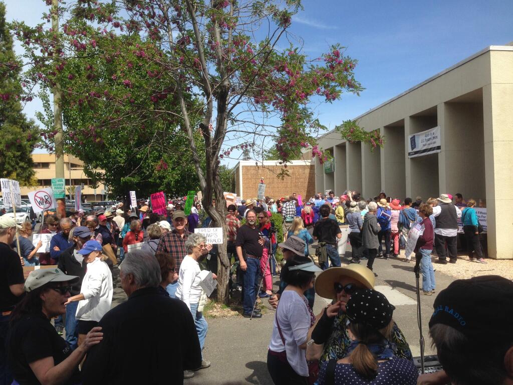 Hundreds of protesters convened Saturday at the Santa Rosa Post Office to call on President Donald Trump to release his tax returns. (Robert Digitale/The Press Democrat)