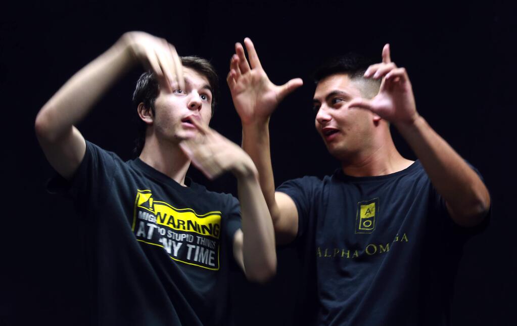 PHOTO: 1 by JOHN BURGESS / The Press Democrat, 2014-Ian Webb, left, and Haziel Perez act out a skit with the Improvaholics at Sonoma State University.
