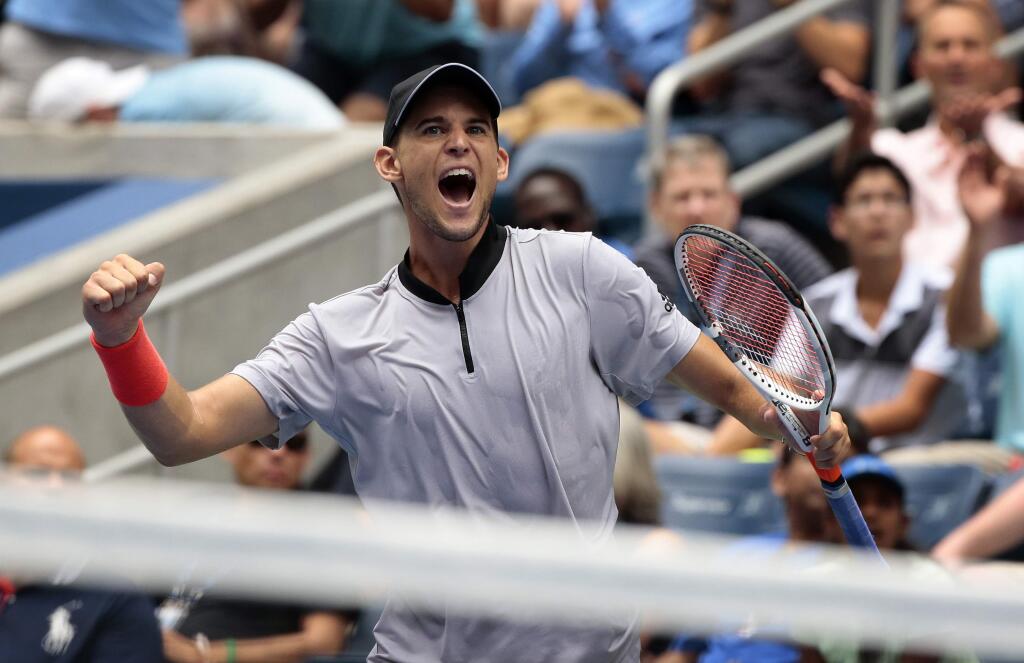 Dominic Thiem, of Austria, reacts after defeating Kevin Anderson, of South Africa, during the fourth round of the U.S. Open tennis tournament, Sunday, Sept. 2, 2018, in New York. (AP Photo/Andres Kudacki)