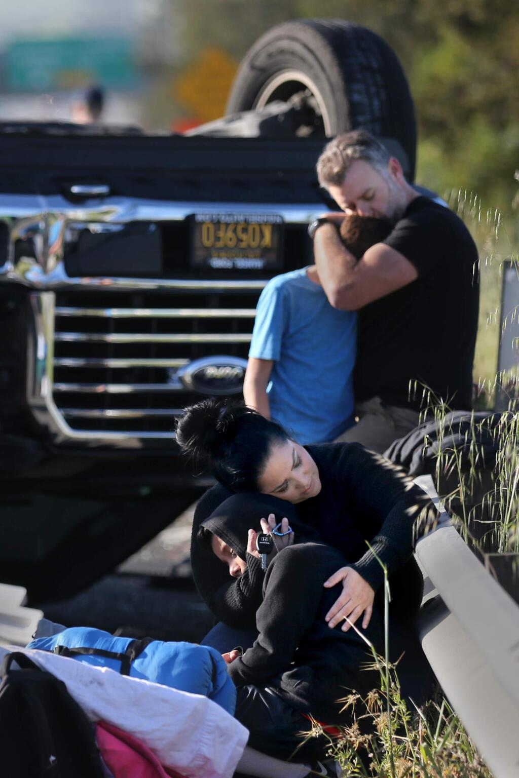Michelle Piscitello comforts her son Rylan, 9, after he was involved in a multi-vehicle accident en route to a 4th grade overnight field trip. The accident occurred on southbound Highway 101 just north of Lakeville Highway in Petaluma on Thursday, April 25, 2019. (BETH SCHLANKER/ PD)