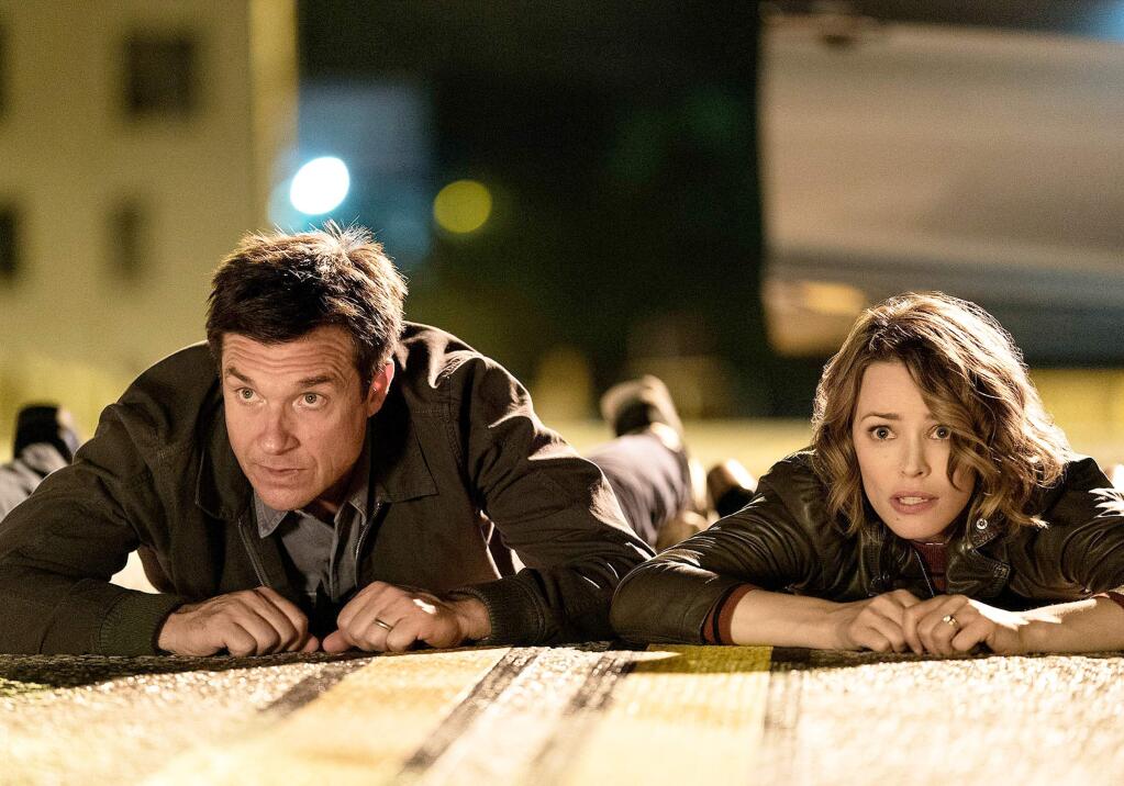 Jason Bateman as Max and Rachel McAdams as Annie in the black comedy 'Game Night,' about a group of friends whose game night turns into a murder mystery. (New Line Cinema)