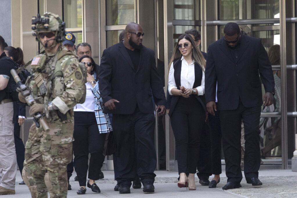 Emma Coronel Aispuro, second from right, wife of Mexican drug lord Joaquin 'El Chapo' Guzman, leaves Brooklyn federal court after her husband's sentencing, Wednesday, July 17, 2019 in New York. Guzman was sentenced Wednesday to life behind bars in a U.S. prison. (AP Photo/Mark Lennihan)