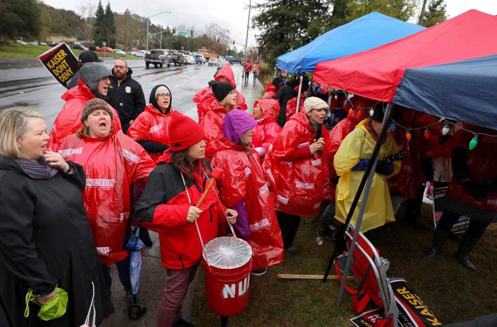 Kaiser Permanente mental healthcare workers chant during a rally in front of the Kaiser Permanente hospital in Santa Rosa during their strike on Wednesday, December 18, 2019. (Christopher Chung/ The Press Democrat)
