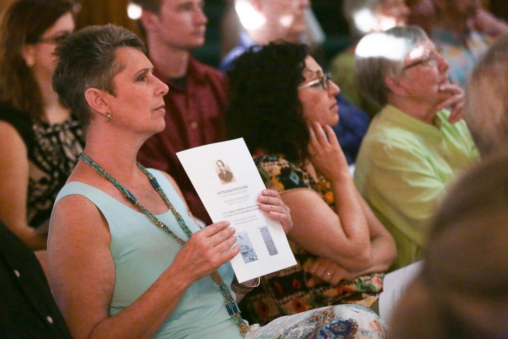 Brenda Roberts of Santa Rosa watches the piano performance intently at the “Gottschalk in Petaluma” 150-Year commemorative concert at the Petaluma Historical Museum on Monday, July 27, 2015. (RACHEL SIMPSON/FOR THE ARGUS-COURIER)