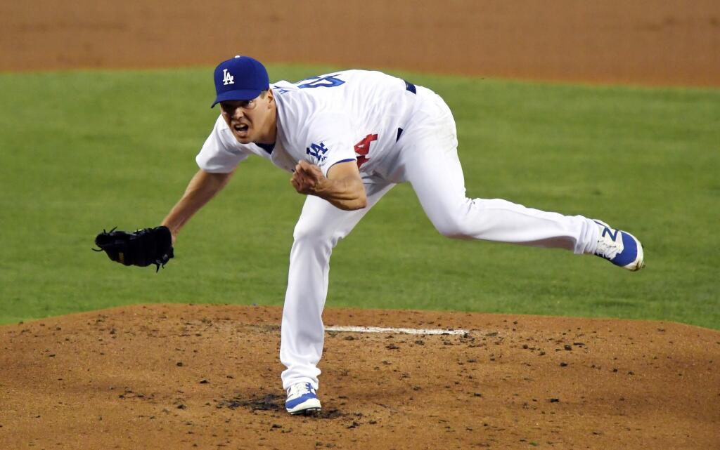 Los Angeles Dodgers starting pitcher Rich Hill follows through on a pitch during the second inning of a baseball game against the San Francisco Giants, Wednesday, Aug. 24, 2016, in Los Angeles. (AP Photo/Mark J. Terrill)