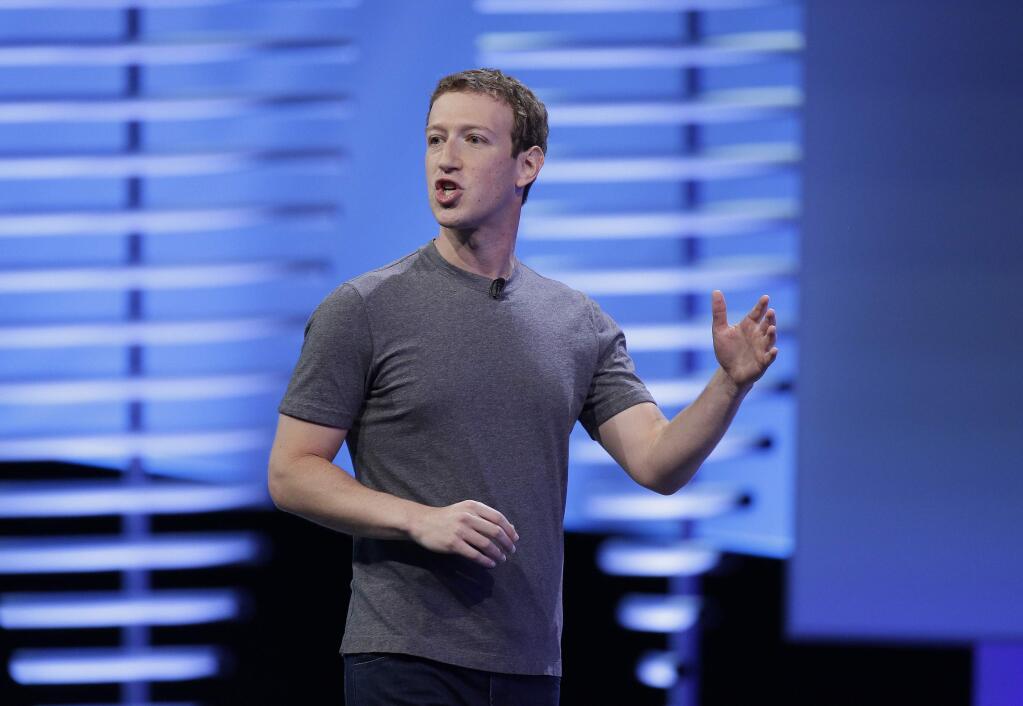 FILE - In this Tuesday, April 12, 2016, file photo, Facebook CEO Mark Zuckerberg delivers the keynote address at the F8 Facebook Developer Conference, in San Francisco. In an interview Thursday, Nov. 10, 2016, with 'The Facebook Effect' author David Kirkpatrick, Zuckerberg said the idea that Facebook influenced the outcome of the U.S. election is a 'crazy idea.' (AP Photo/Eric Risberg, File)
