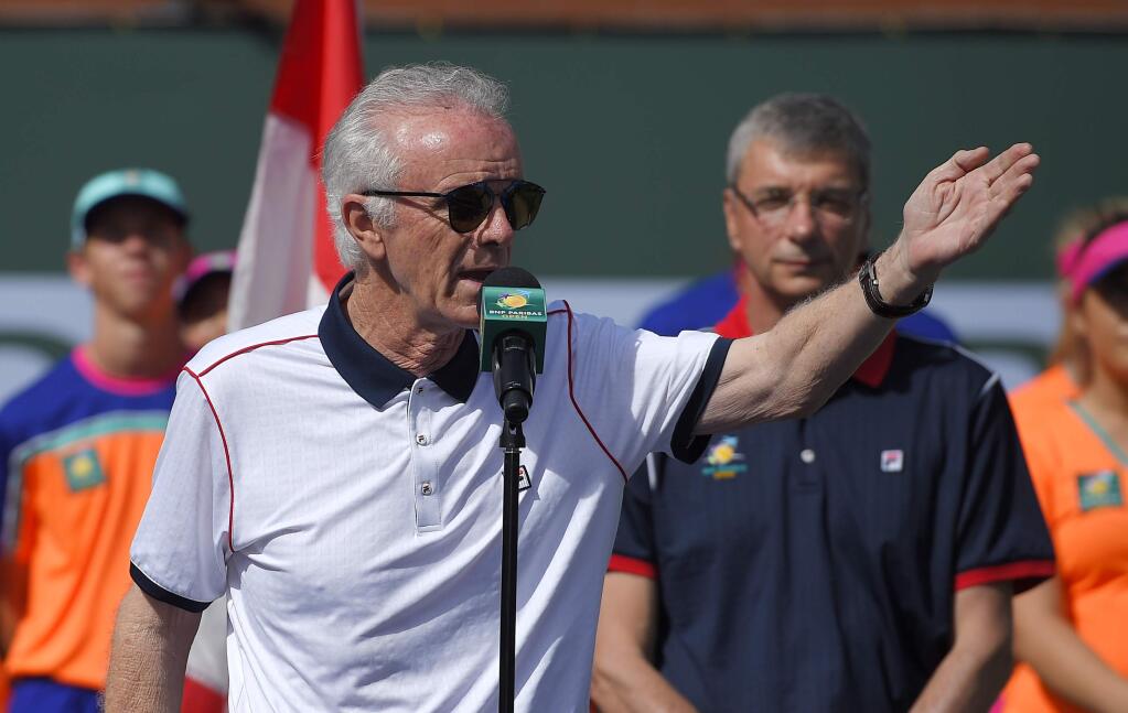 FILE - In this March 20, 2016, file photo, tournament director Raymond Moore gestures while speaking at the BNP Paribas Open tennis tournament in Indian Wells, Calif. The former tournament director at Indian Wells who now runs the WTA Tour calls his successor's critical comments about women's tennis players 'disappointing and alarming.' Before Sunday's finals at the BNP Paribas Open, current tournament director Raymond Moore told reporters that the women 'ride on the coattails of the men.' He later issued a written apology.(AP Photo/Mark J. Terrill, File)