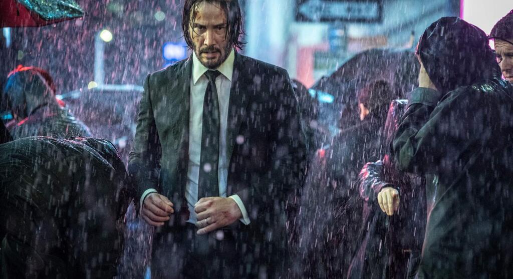 Keanu Reeves and Halle Berry in 'John Wick: Chapter 3 --- Parabellum,' in which Wick (Reeves) has a $14 million price tag on his head and an army of bounty-hunting killers on his trail after he kills a member of the shadowy international assassin's guild, the High Table, and the world's most ruthless hit men and women await his every turn. (Summit Entertainment)