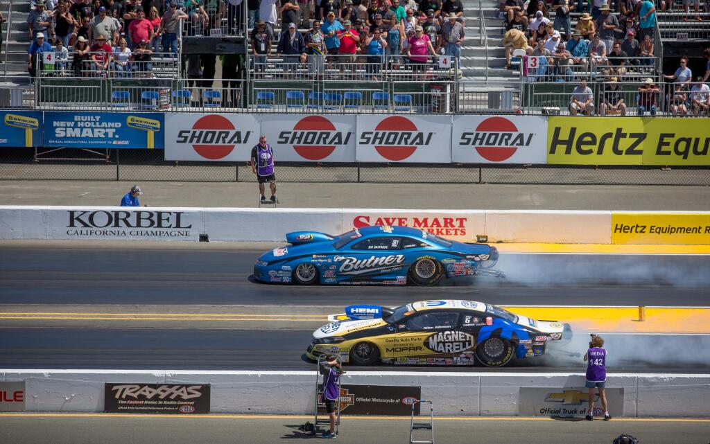 Bo Butner III, top, and Allen Johnson battle it out in Pro Stock cars during the NHRA Sonoma Nationals at Sonoma Raceway, south of Petaluma Calif. Sunday, August 2, 2015.