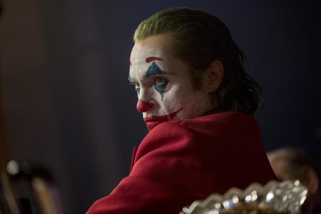 This image released by Warner Bros. Pictures shows Joaquin Phoenix in a scene from 'Joker,' in theaters on Oct. 4. Alarmed by violence depicted in a trailer for the upcoming movie “Joker,” some relatives of victims of the 2012 Aurora movie theater shooting asked distributor Warner Bros. on Tuesday to commit to gun control causes. Twelve people were killed in the suburban Denver theater during a midnight showing of the Batman film, “The Dark Knight Rises,” also distributed by Warner Bros. (Niko Tavernise/Warner Bros. Pictures via AP)